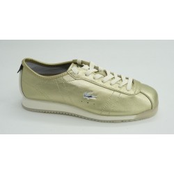 Deportivo mujer marca lacosteen color oro